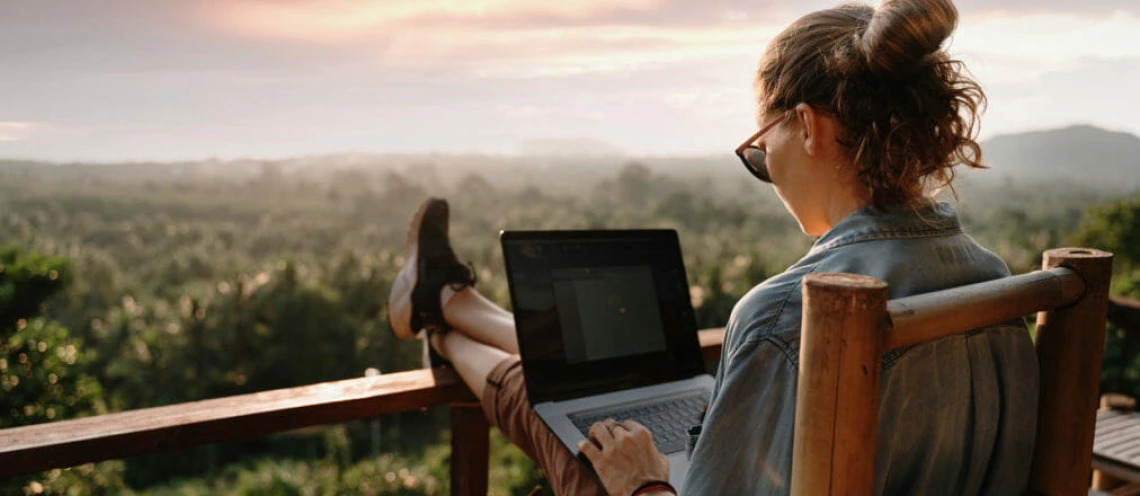 student on a laptop outside